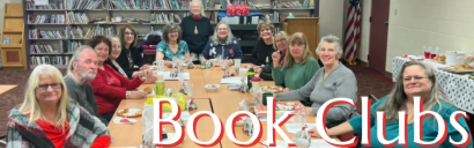 Several people sitting around a table; click for information on book clubs